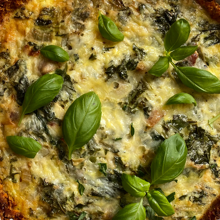 Sweet Potato Crusted Quiche with Smoky Bacon and Spring Greens